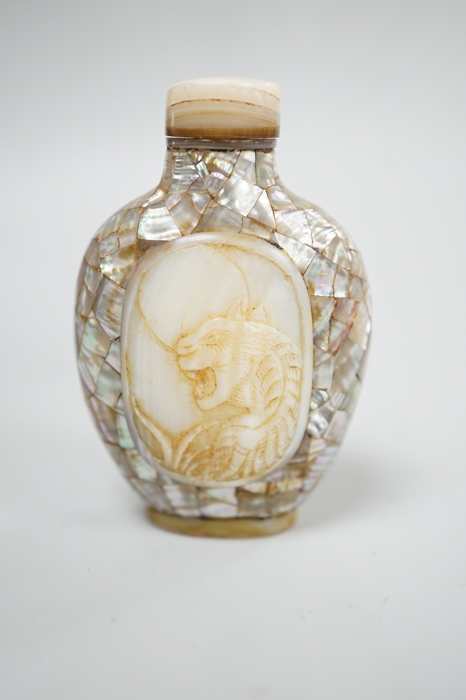 A Chinese shell and mother of pearl snuff bottle, Tongzhi mark probably later, 6.2 cm high including stopper